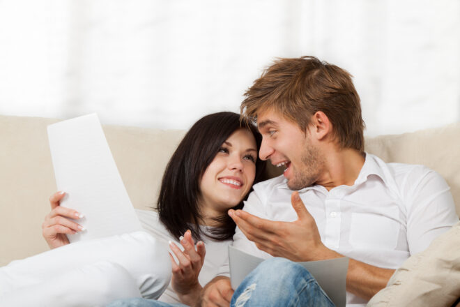 Happy Couple reading Mail